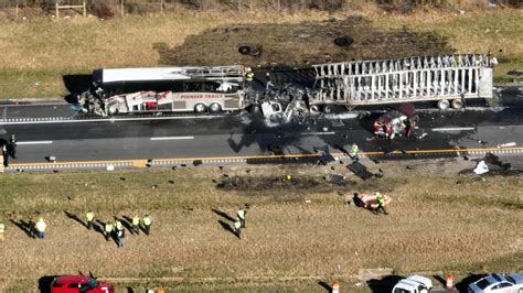 Six people are killed in crash involving bus and semi on I-70